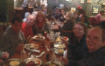Group Of People Eating Together